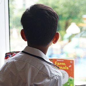 Child looking out of window